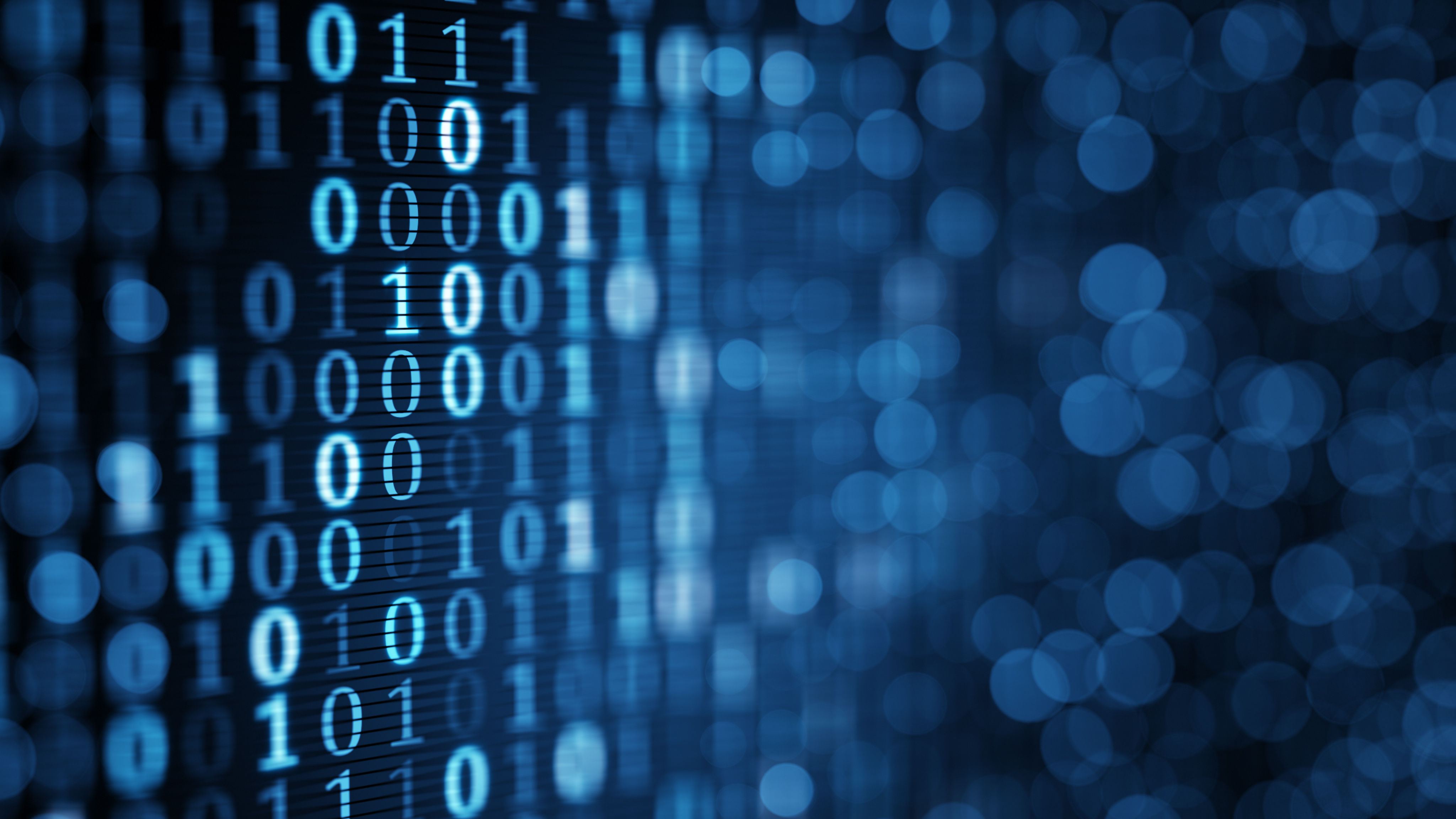 blue digital binary data on computer screen. Close-up shallow DOF
